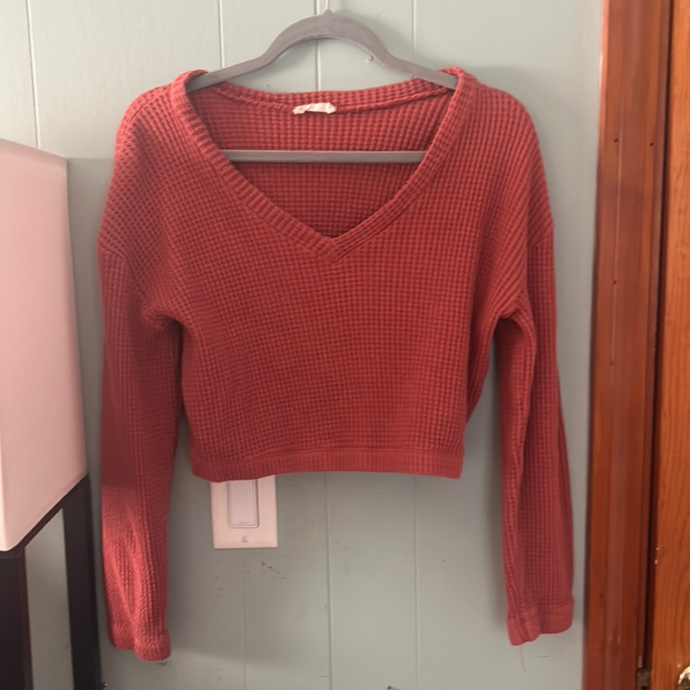 Never worn sweater from Alter’d State brown with redish undertones.